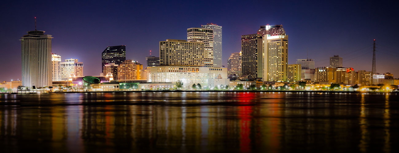 Downtown New Orleans, Louisiana and the Mississippi River at twilight